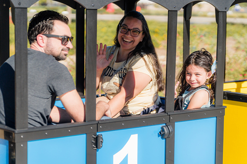 Family enjoying a train ride at Waterpalooza.