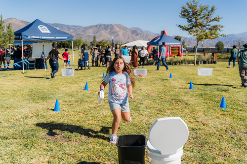 Girl participating in Smart Flush Relay Race at Waterpalooza.